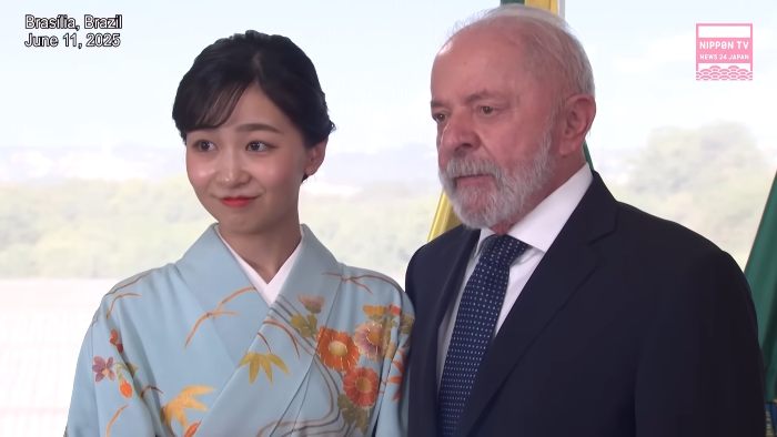 Japanese Princess Kako wearing a traditional kimono while standing next to a man in a suit at an event in Brasilia.
