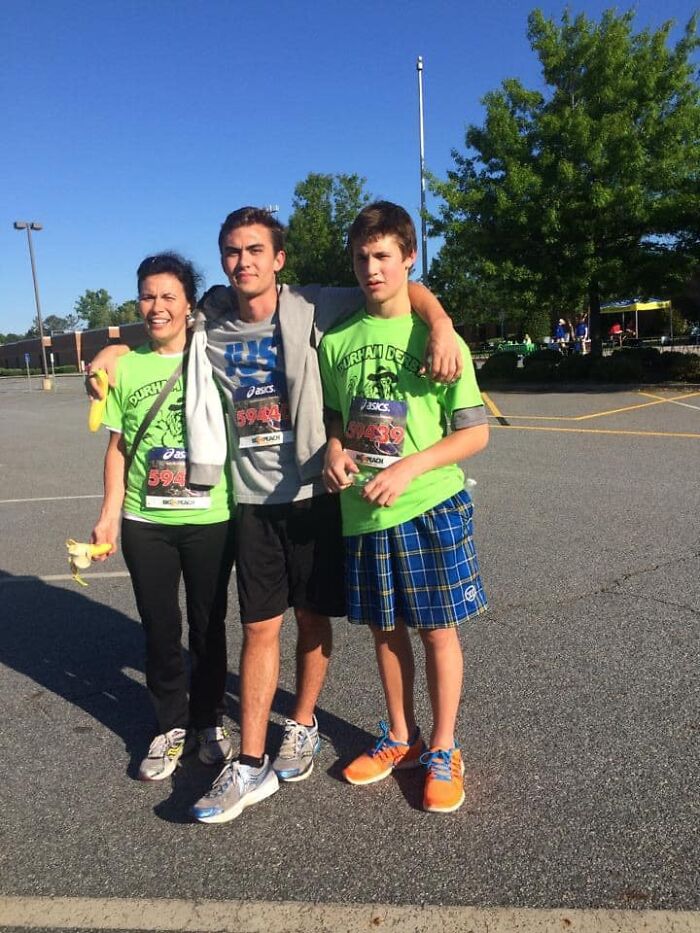 Three runners in race gear posing outdoors after a run, illustrating how running helped reclaim joy and identity after cancer.