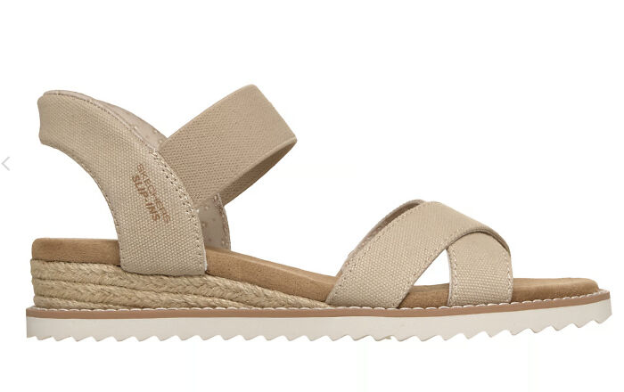 Beige stylish and comfortable sandal with cushioned sole and fabric straps, perfect for sandal season in Europe. - 1