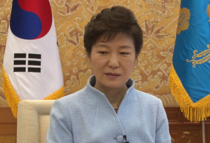 South Korean female leader speaking in formal setting with national flags, illustrating interesting rumors that turned out true.