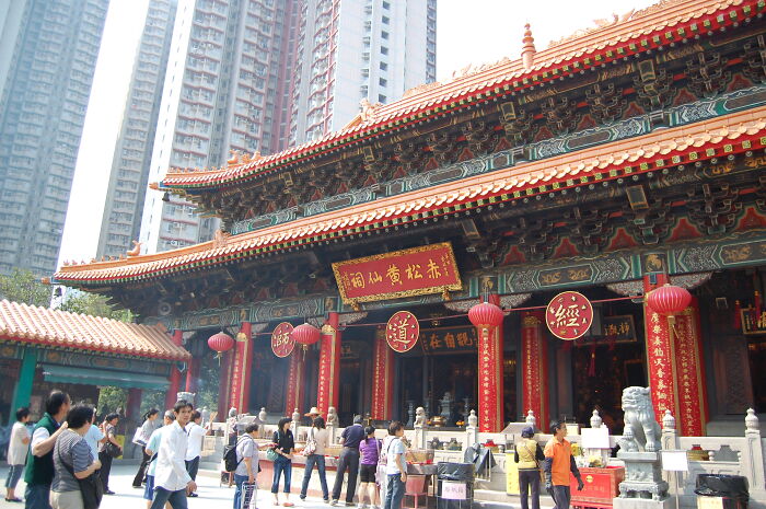 Traditional Asian temple in a bustling city, representing one of the smartest countries shaping the future of the world.