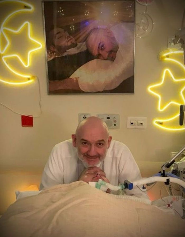 Man with a beard beside a bedridden patient on life support, symbolizing the sleeping prince of Saudi Arabia in coma. Man with a beard beside a bedridden patient on life support, symbolizing the sleeping prince of Saudi Arabia in coma.