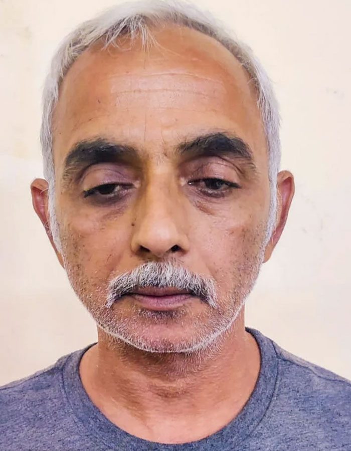 Middle-aged man with gray hair and mustache against a neutral background related to male ego controversy in tennis case. Middle-aged man with gray hair and mustache against a neutral background related to male ego controversy in tennis case.