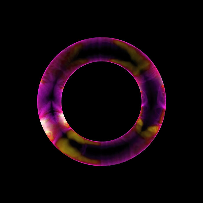 Abstract space photo featuring a vibrant purple and yellow ring against a black background from astronomy photographer of the year.