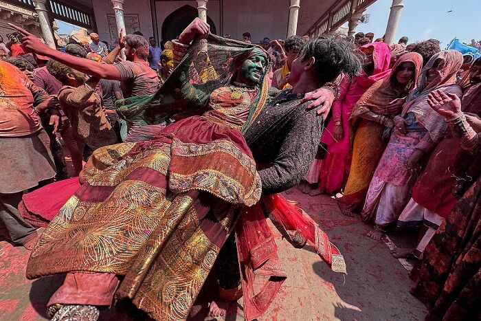 Colorful street photo capturing the vibrant spirit and traditional celebration in India by photographer Rohit Vohra.