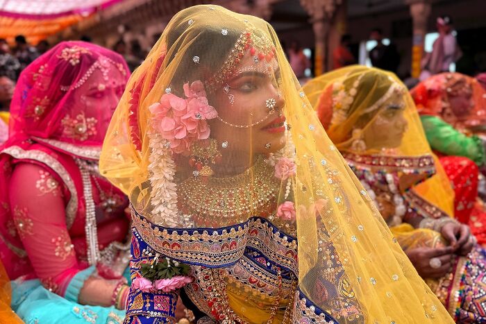 Colorful street photos capturing traditional Indian brides adorned in intricate jewelry and vibrant clothing at a festive event.