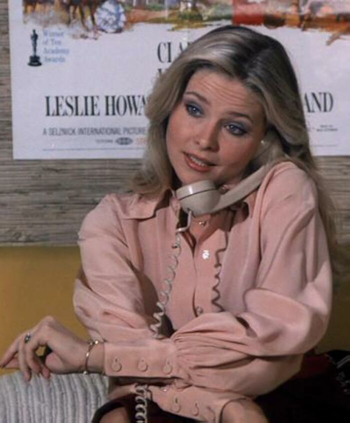 Bond Girl at 70 using a telephone, looking different in a rare sighting decades after film with Timothy Dalton. Bond Girl at 70 using a telephone, looking different in a rare sighting decades after film with Timothy Dalton.