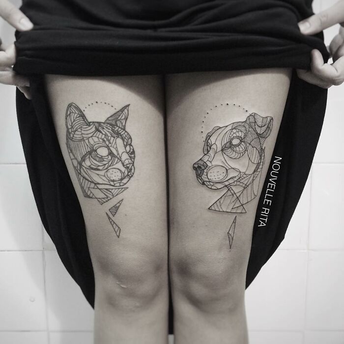 Geometric line art tattoos of a cat and a dog on thighs, showcasing one of the best tattoos with intricate details.