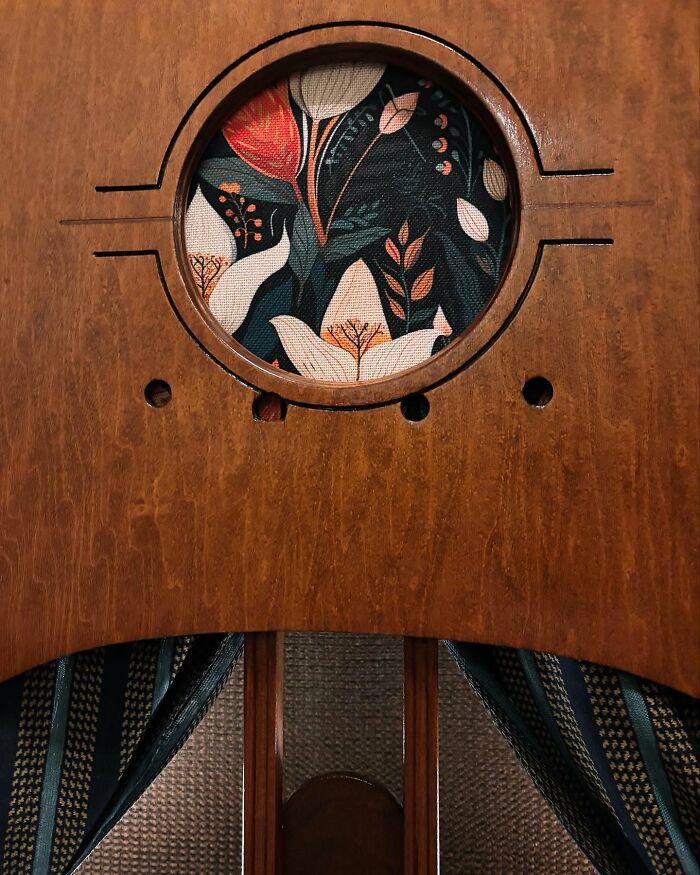 Vintage TV repurposed into a cozy cat bed with floral fabric inside, showcasing nostalgic nooks for pets to relax in.