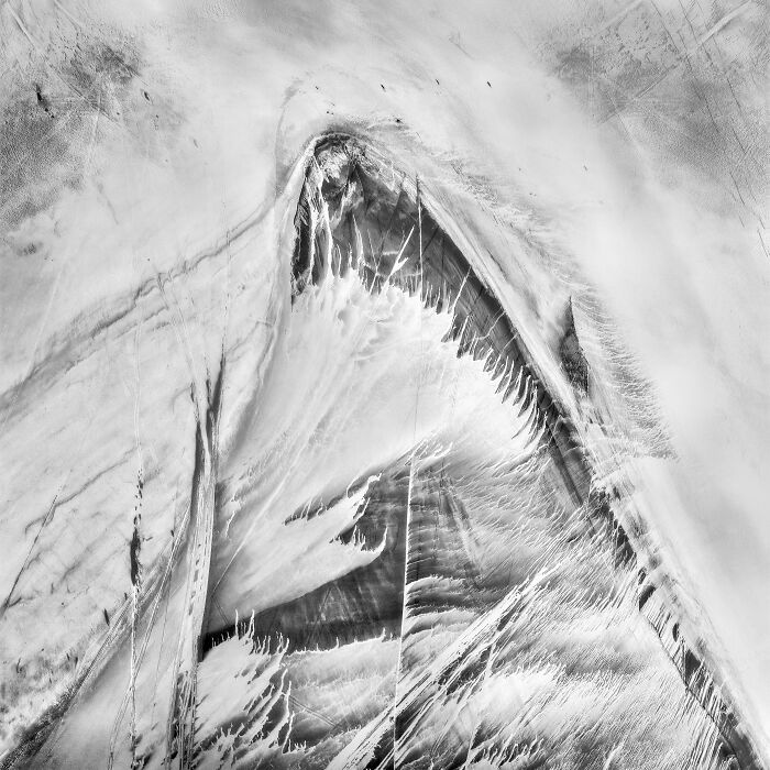 Abstract black and white aerial shot showing textured sand dunes and patterns from the International Photographer of the Year.