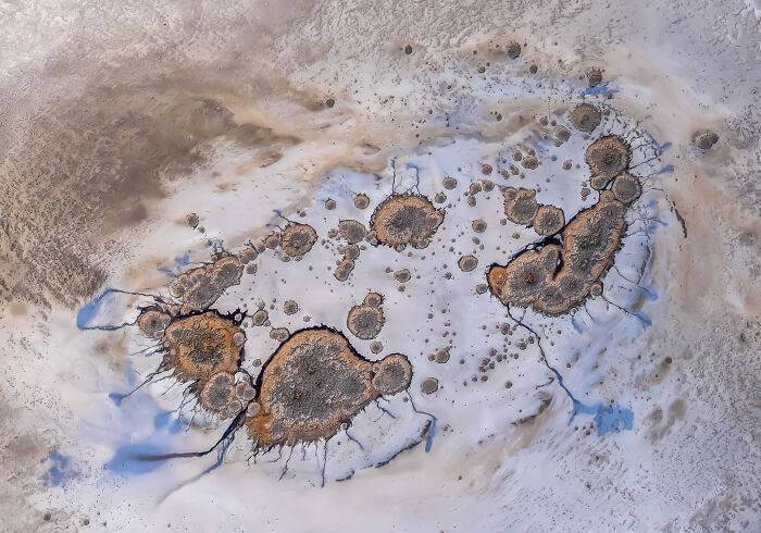 Aerial shot of unique desert formations and colorful patterns captured in winning aerial photography from the International Photographer.