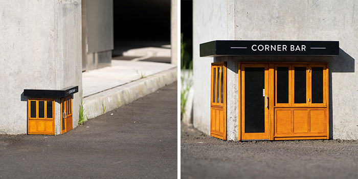 Miniature street scene showing a tiny corner bar popping up on a city sidewalk, capturing attention with its detailed design.