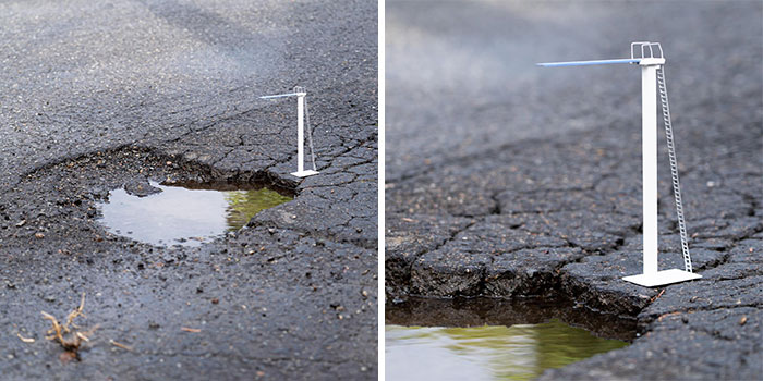 Tiny street scenes showing a miniature diving board installed by a puddle on c*****d asphalt in the city.