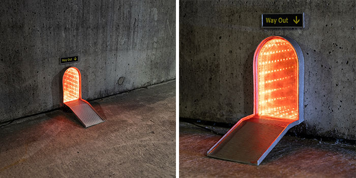 Miniature street scene with a glowing "Way Out" tunnel entrance, part of funny tiny street scenes popping up in the city.