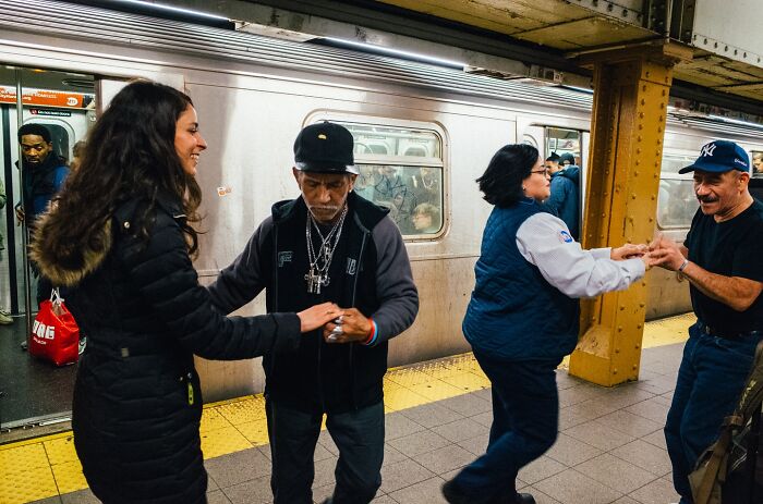 New York City subway passengers dancing and connecting in powerful street moments captured by photographer.