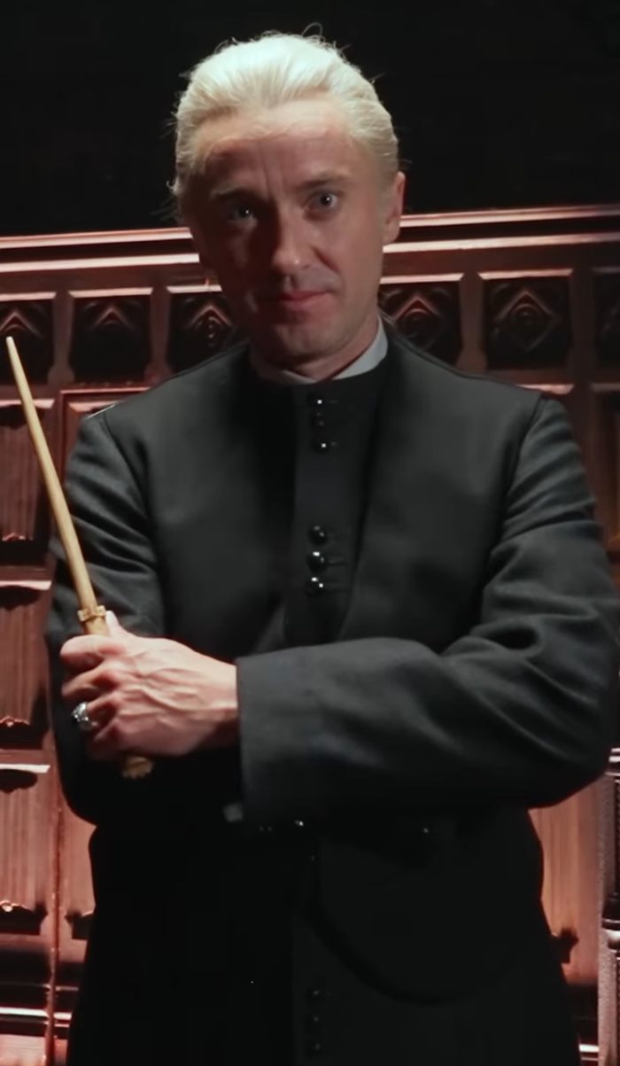 Harry Potter stars in surprise reunion, dressed as characters holding wands, exciting fans worldwide.