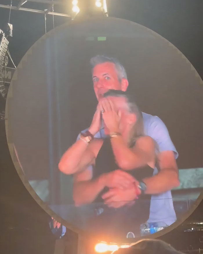 Couple reacting on Coldplay kiss cam during concert, highlighting staff's reaction to toxic CEO drama.