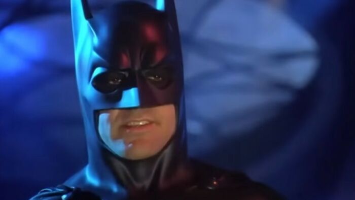 Batman character in a dark costume with a serious expression, featured in the worst movies of all time list.