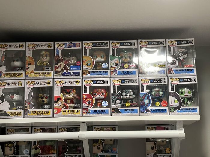 Collection of Funko Pop figures displayed on shelves highlighting trends leading to overconsumption in collectible items. - 23
