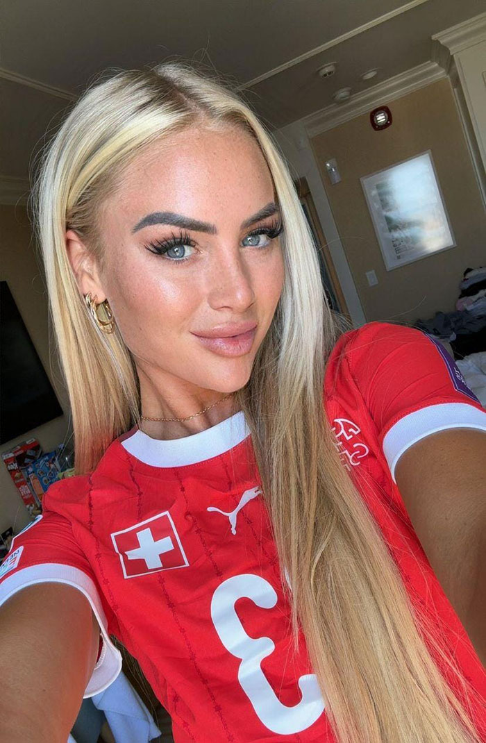 Close-up photo of the world's prettiest footballer in a red jersey showing a stunning transformation selfie.