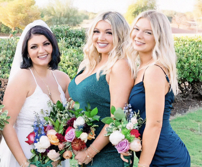 Three smiling women in dresses holding bouquets outdoors, related to Idaho massacre victim Kaylee Goncalves trial. - 2