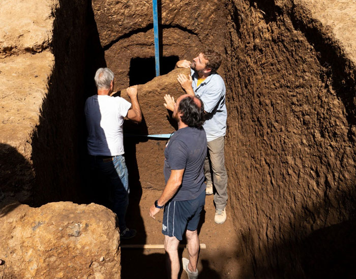 Three archaeologists uncover a 2,600-year-old tomb in Italy, revealing a mysterious burial chamber inside the excavation site.