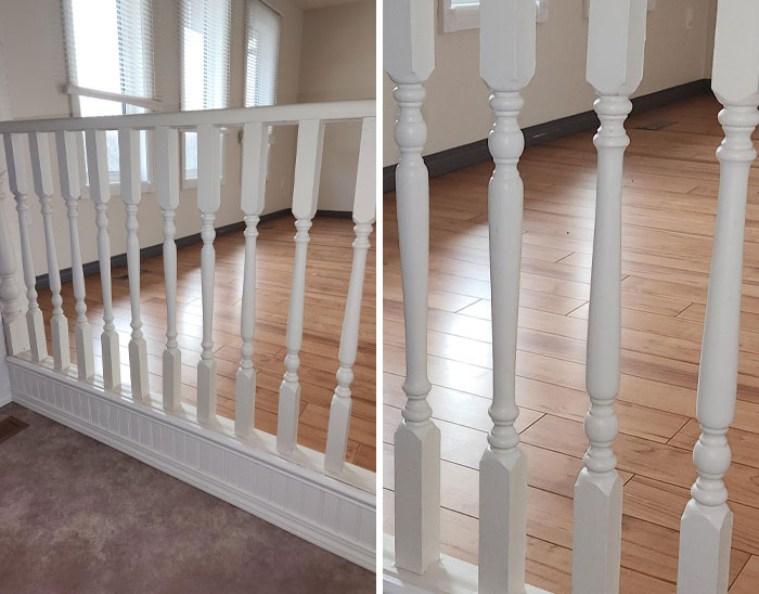 White wooden railing with unevenly spaced spindles on a hardwood floor, a common OCD annoyance.