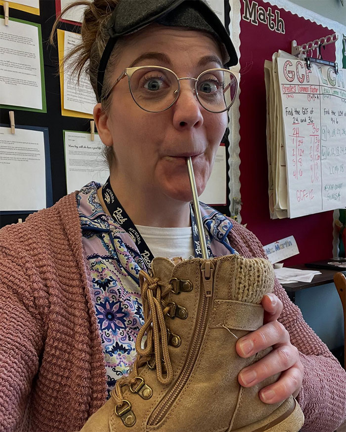 Person drinking from a hiking boot using a metal straw, showcasing creative sippers who chose to drink from anything but a cup.