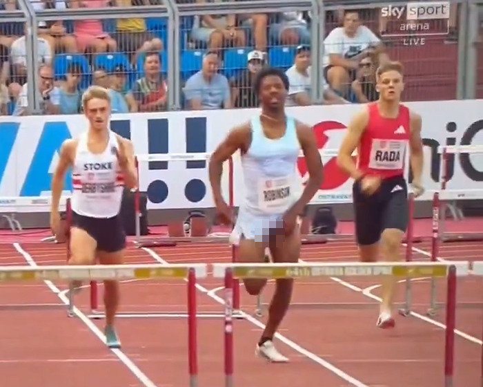 Sprinter in white shorts competing in a race as his privates accidentally fall out during the event, creating a viral moment. Sprinter in white shorts competing in a race as his privates accidentally fall out during the event, creating a viral moment.