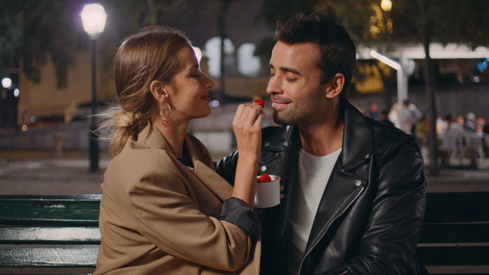 Couple enjoying a romantic date at night, highlighting absentee mom expecting teen to babysit fianc&eacute;&rsquo;s kids.