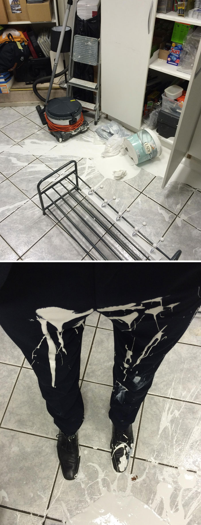 Spilled white paint on tiled floor, with paint splattered on black pants and shoes, illustrating epic work fails.