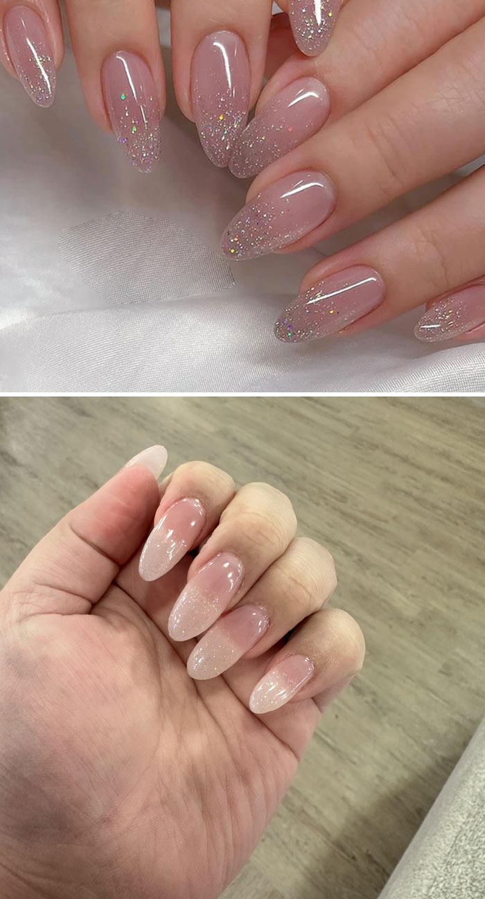 Close-up of manicured nails with glittery glow-up design shown on two different hands in salon setting.