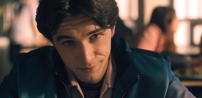 Close-up of a young man watching one of the best Netflix shows selected by netizens that keep viewers coming back. - 19