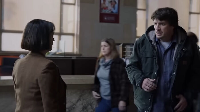 Two people having a serious conversation in a public indoor space, scene from popular binge-worthy Netflix shows. - 7