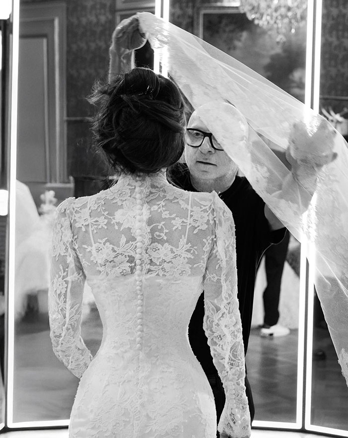 Lauren Sanchez wedding dress and veil being adjusted amid photoshopped wedding pictures editing blunders discussion.