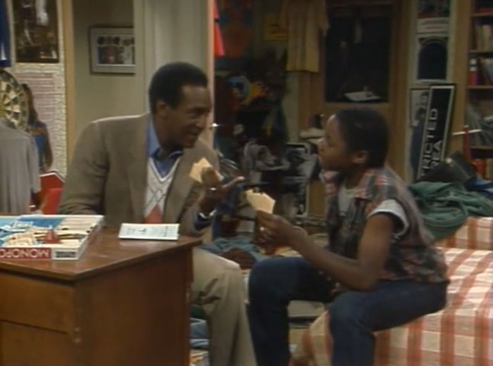 Bill Cosby and Malcolm-Jamal Warner sharing a moment on set, reflecting on Bill Cosby breaking his silence after tragedy. - 10