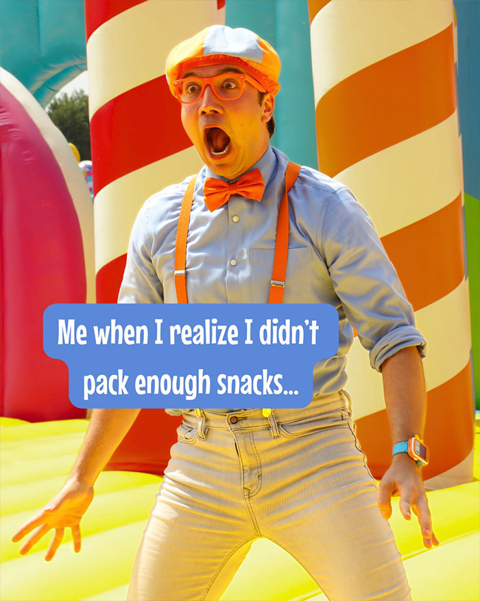 Blippi wearing orange suspenders and bow tie, showing surprise on colorful inflatable play area for kids content. - 8