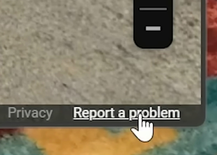 Cursor hovering over the report a problem option on Google Maps, related to blurring houses for privacy reasons.