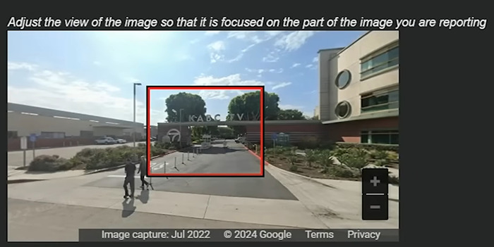 View of a street with buildings and people, illustrating houses being blurred on Google Maps for privacy reasons.