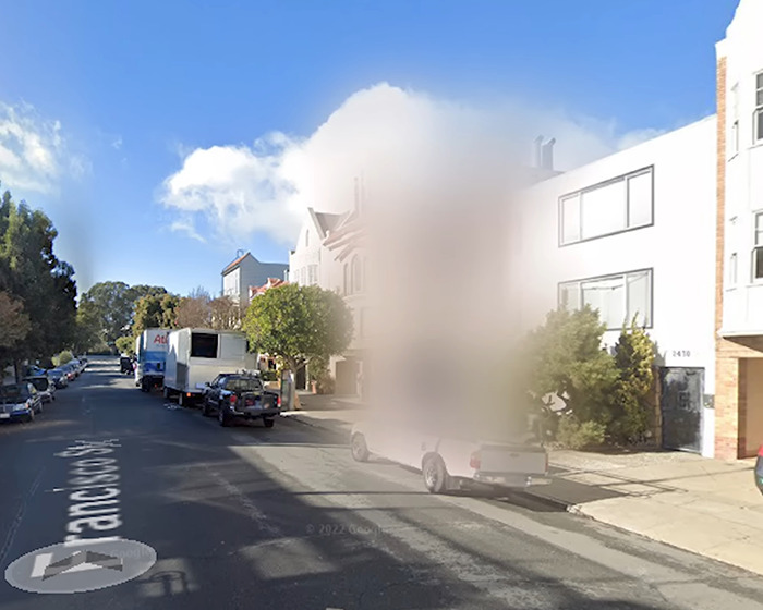 Neighborhood street with a house blurred on Google Maps showing why people are blurring their houses for privacy.