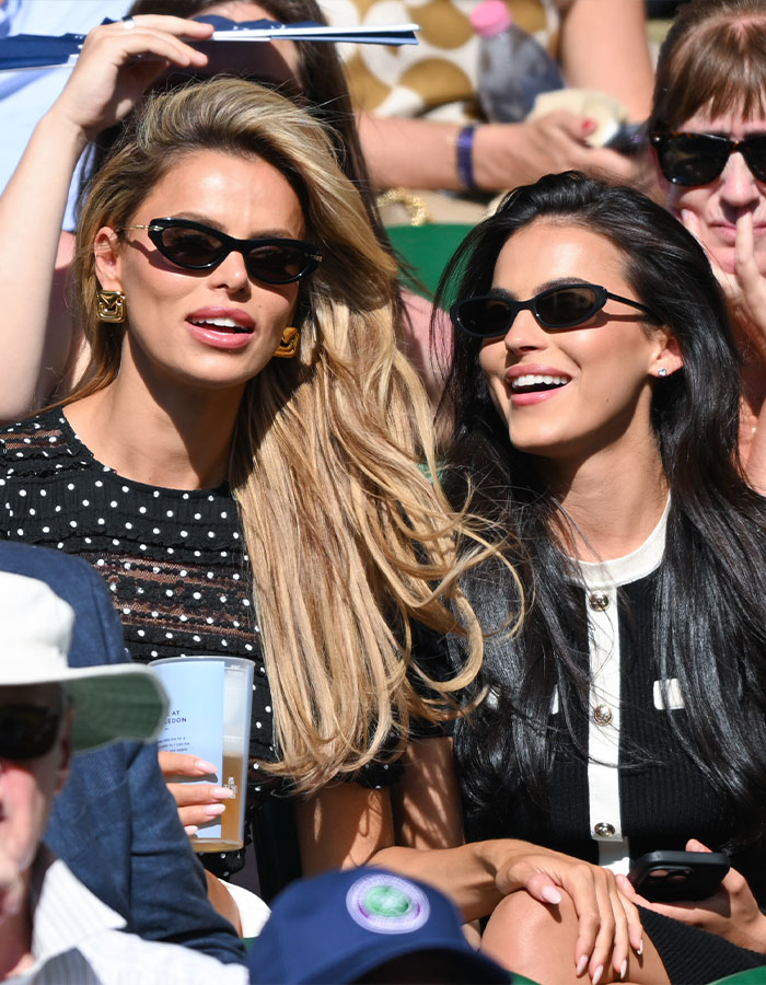 Brooks Nader and a friend wearing sunglasses, praised for normalizing period leaks during a public event.