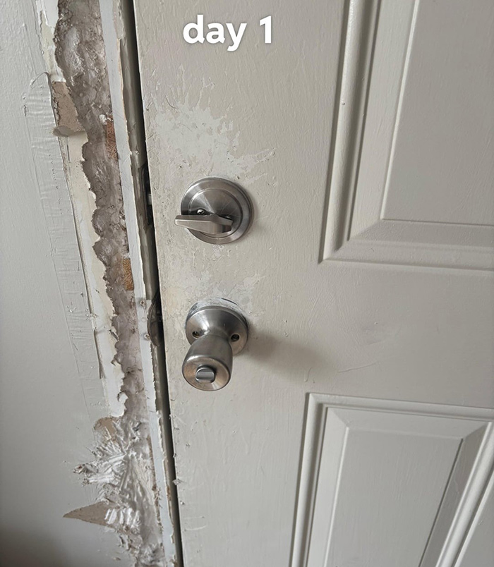 Damaged door frame and lock after dog insisted on boarding, marked as day 1 of repair process.