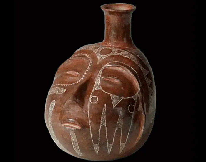 Ancient Native American pottery with carved face details representing cultural heritage and language risks extinction. - 14