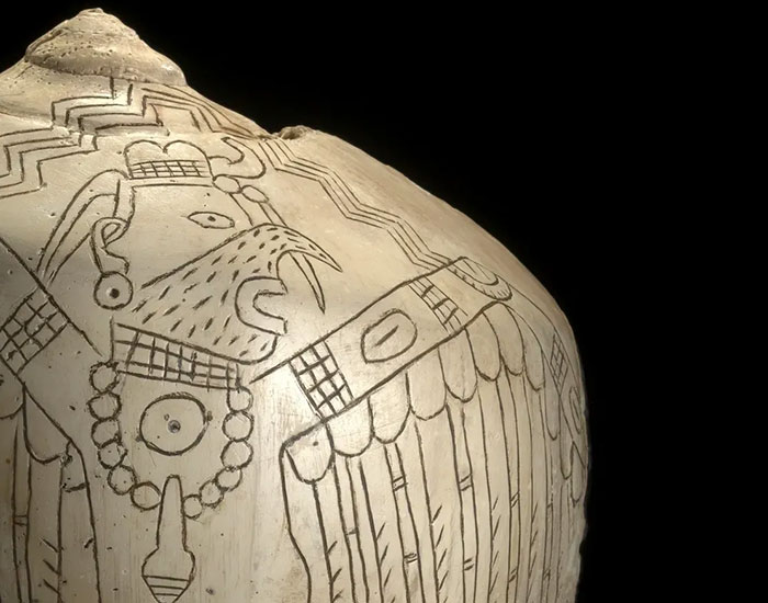 Ancient Native American pottery depicting a bird design, symbolizing cultural heritage and language risks extinction. - 13