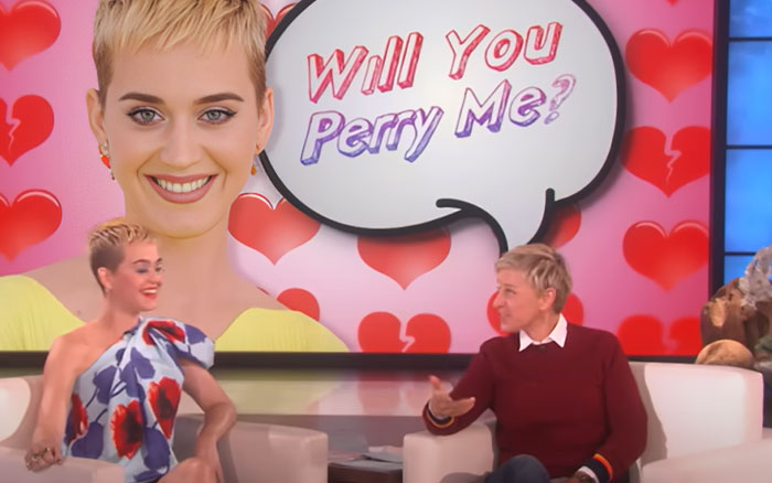 Katy Perry and Ellen DeGeneres discussing celebrity breakups and men avoiding therapy on a daytime talk show set. - 17