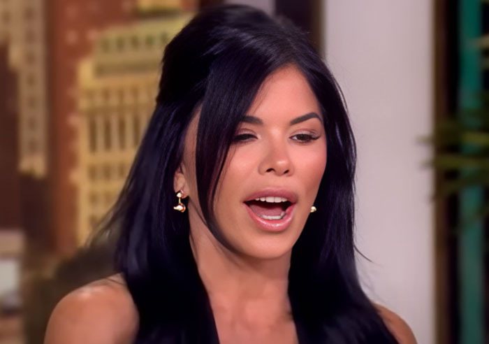 Woman with long black hair speaking in an interview about wild things celebrities have done after a breakup. - 3