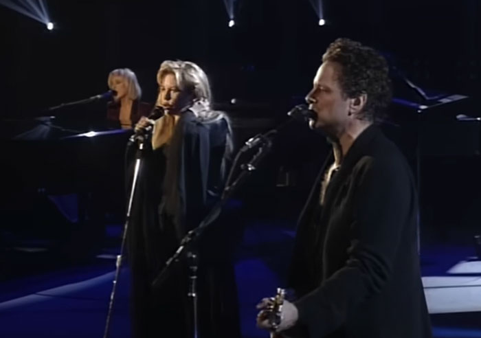 Three celebrities performing live on stage, highlighting wild things celebrities have done after a breakup. - 2