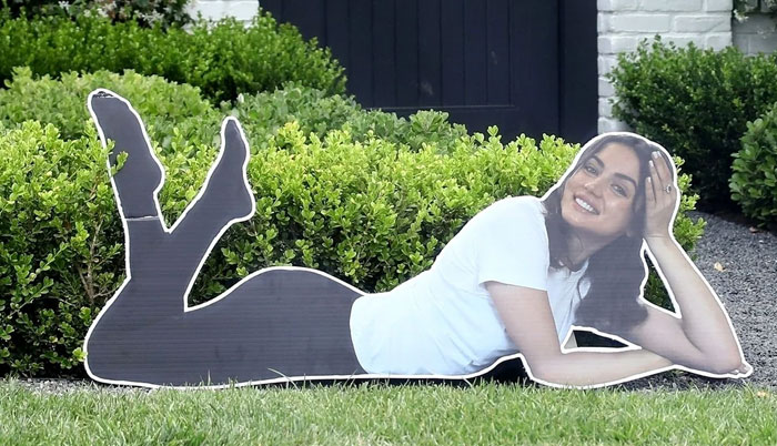 Cutout of a woman lying on grass, smiling, illustrating celebrities doing wild things after a breakup, avoiding therapy. - 4