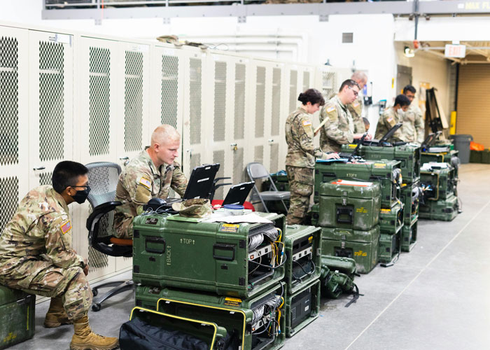 Soldiers inspecting and tracking military equipment in storage, addressing missing inventory issues over several months.