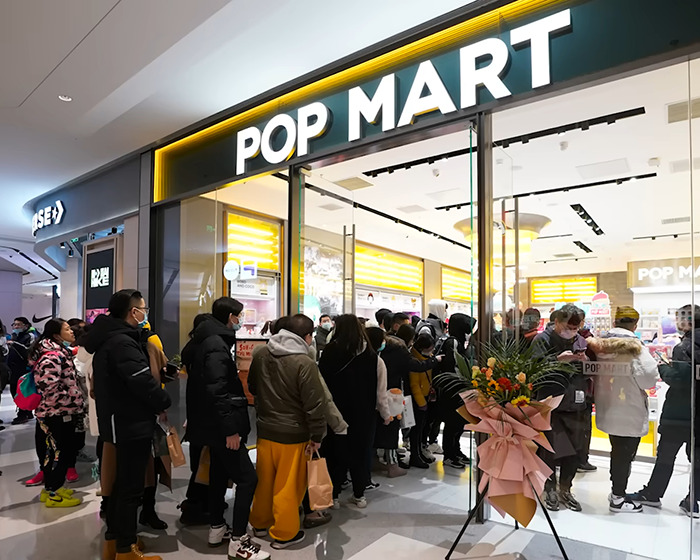 Shoppers lined up outside a POP MART store amid city bans and dark conspiracy concerns in Labubu.
